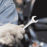 A Mechanic Holding A Wrench